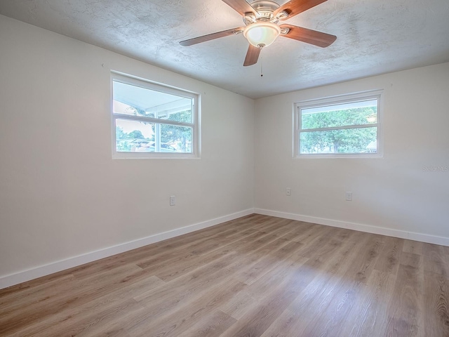 59 S Columbus St, Beverly Hills, FL 34465 - spare room featuring light wood-type flooring, baseboards, a textured ceiling, and a ceiling fan