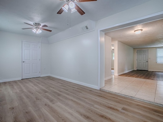 59 S Columbus St, Beverly Hills, FL 34465 - empty room with a ceiling fan, wood finished floors, baseboards, and a textured ceiling