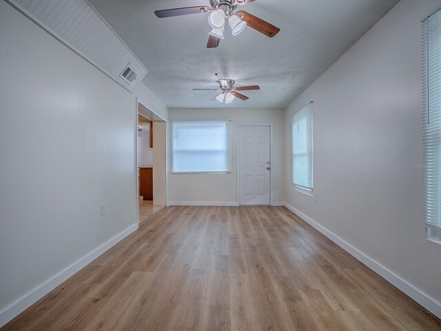 59 S Columbus St, Beverly Hills, FL 34465 - spare room featuring ceiling fan, light wood-style flooring, and baseboards