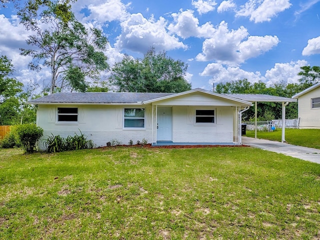 59 S Columbus St, Beverly Hills, FL 34465 - view of front of property featuring brick siding, concrete driveway, and a carport