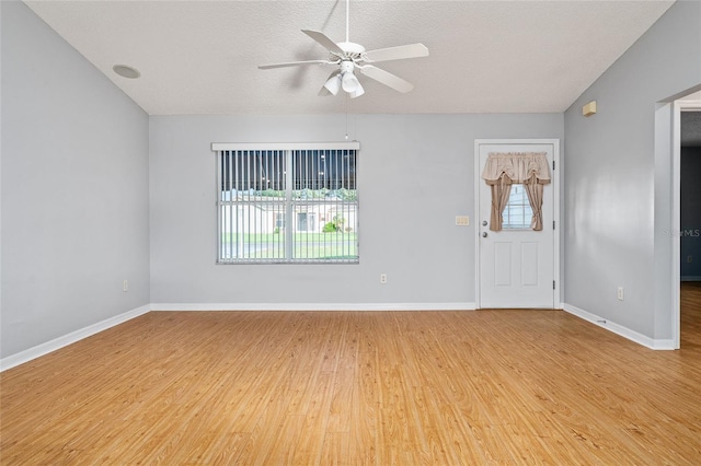 2557 Privada Dr, The Villages, FL 32162 - spare room featuring light wood-type flooring, a ceiling fan, a textured ceiling, and baseboards