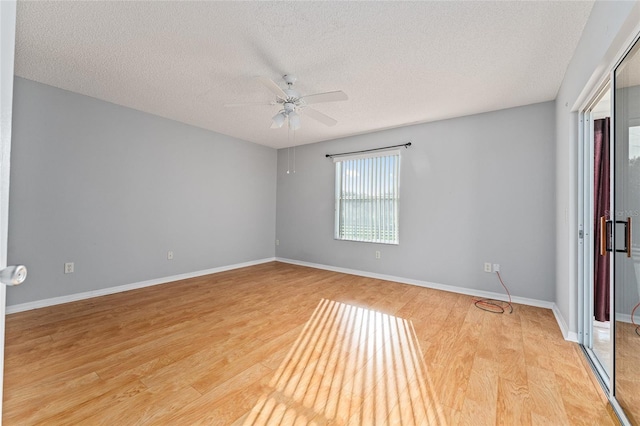 2557 Privada Dr, The Villages, FL 32162 - spare room featuring light wood finished floors, ceiling fan, a textured ceiling, and baseboards