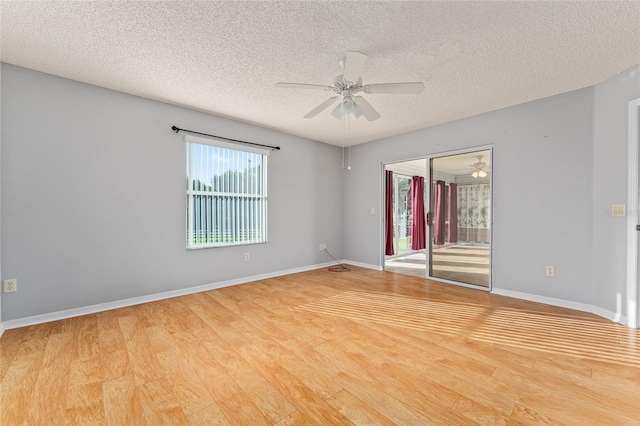 2557 Privada Dr, The Villages, FL 32162 - spare room with a ceiling fan, a textured ceiling, wood finished floors, and baseboards