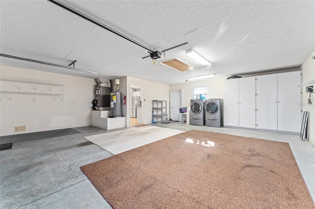 2557 Privada Dr, The Villages, FL 32162 - garage with washer and dryer, freestanding refrigerator, heating unit, and a garage door opener