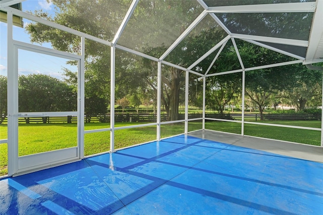 2557 Privada Dr, The Villages, FL 32162 - view of pool with a lawn, view of scattered trees, and glass enclosure