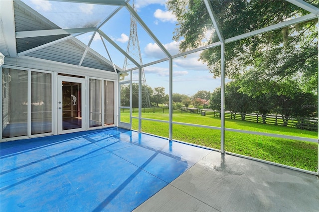 2557 Privada Dr, The Villages, FL 32162 - unfurnished sunroom featuring vaulted ceiling