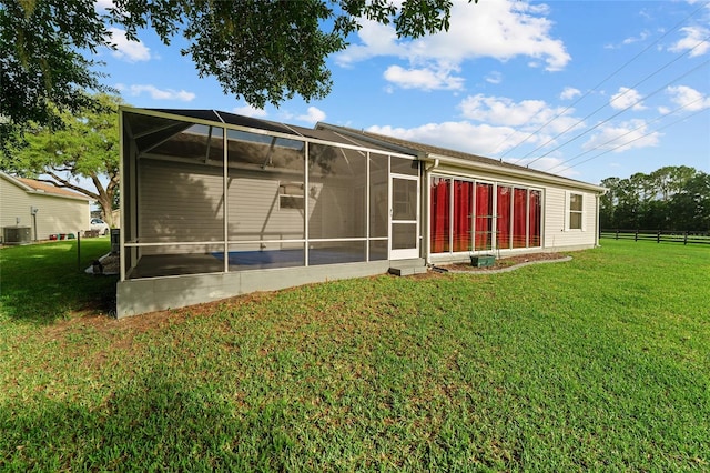 2557 Privada Dr, The Villages, FL 32162 - back of house with cooling unit and a sunroom