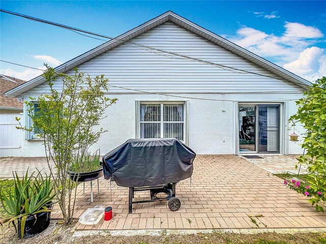 1034 Copenhagen Way, Winter Garden, FL 34787 - rear view of house featuring a patio area and stucco siding