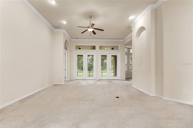 29152 David Ct, Tavares, FL 32778 - unfurnished living room featuring a ceiling fan, crown molding, light carpet, recessed lighting, and french doors
