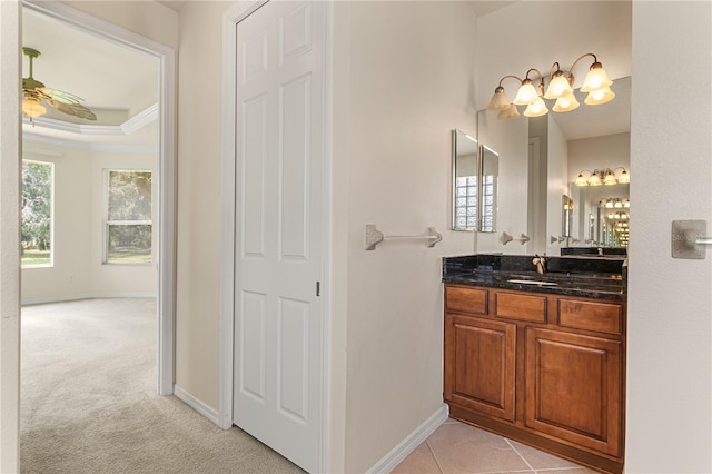 29152 David Ct, Tavares, FL 32778 - bathroom with vanity, a tray ceiling, crown molding, and a chandelier