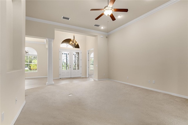 29152 David Ct, Tavares, FL 32778 - entryway featuring decorative columns, light colored carpet, ornamental molding, a chandelier, and ceiling fan