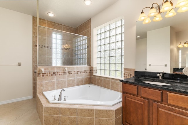 29152 David Ct, Tavares, FL 32778 - full bath with a chandelier, a bath, vanity, tile patterned flooring, and a tile shower