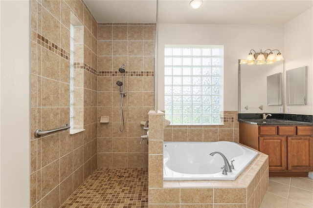 29152 David Ct, Tavares, FL 32778 - bathroom featuring a garden tub, a tile shower, vanity, and tile patterned flooring