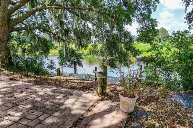 29152 David Ct, Tavares, FL 32778 - view of patio / terrace featuring a water view
