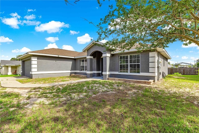 70 Locust Pass Run, Ocala, FL 34472 - single story home featuring stucco siding, a garage, and driveway