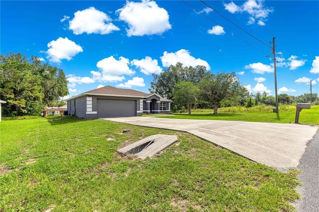 70 Locust Pass Run, Ocala, FL 34472 - view of green lawn featuring driveway and an attached garage