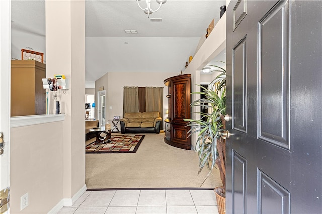 70 Locust Pass Run, Ocala, FL 34472 - foyer entrance with light carpet, light tile patterned floors, and vaulted ceiling