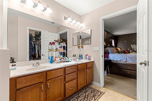 70 Locust Pass Run, Ocala, FL 34472 - bathroom with ensuite bath, double vanity, tile patterned flooring, and a walk in closet