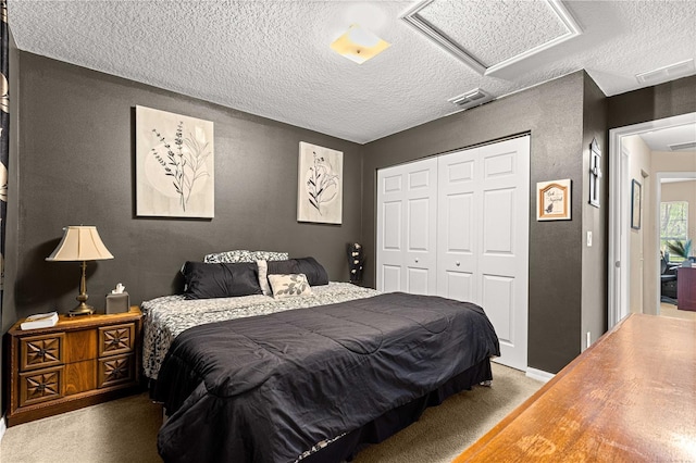 70 Locust Pass Run, Ocala, FL 34472 - bedroom featuring attic access, a textured ceiling, a closet, and a textured wall