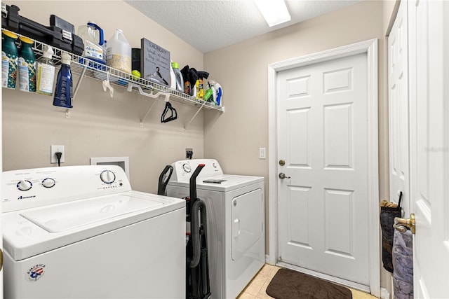 70 Locust Pass Run, Ocala, FL 34472 - laundry area with washer and clothes dryer, a textured ceiling, and light tile patterned floors