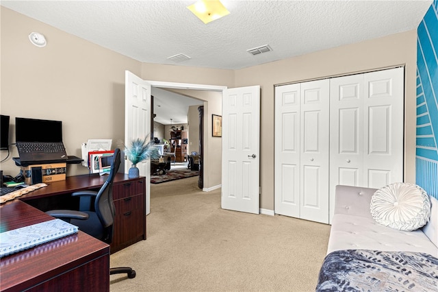 70 Locust Pass Run, Ocala, FL 34472 - bedroom featuring light carpet, an office area, a closet, and a textured ceiling