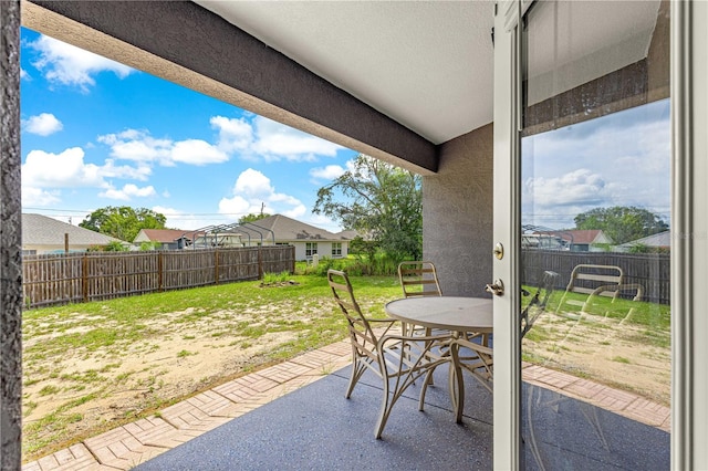 70 Locust Pass Run, Ocala, FL 34472 - fenced backyard featuring a patio area and outdoor dining space