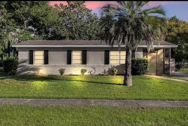 2433 Adams Ave, Deltona, FL 32738 - ranch-style home featuring a front lawn