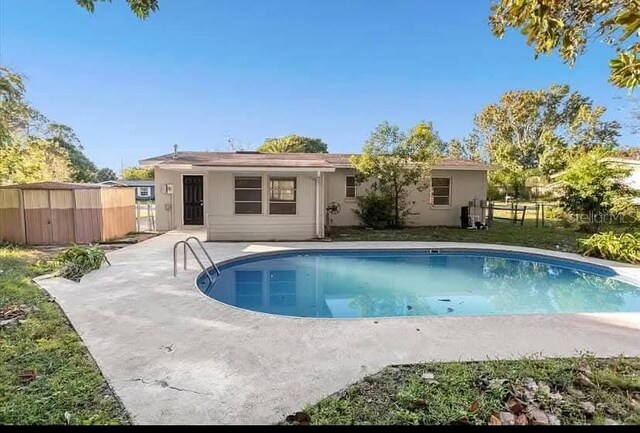 2433 Adams Ave, Deltona, FL 32738 - rear view of property featuring a patio