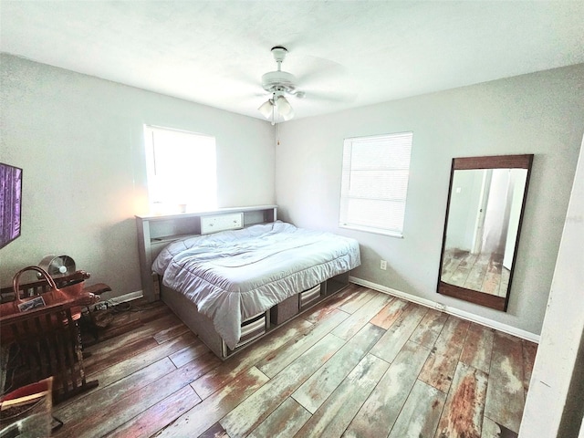 2433 Adams Ave, Deltona, FL 32738 - bedroom featuring wood-type flooring, baseboards, and ceiling fan