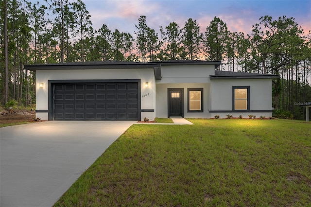 1809 W Linden Dr, Citrus Springs, FL 34434 - modern home featuring stucco siding, driveway, a garage, and a front lawn