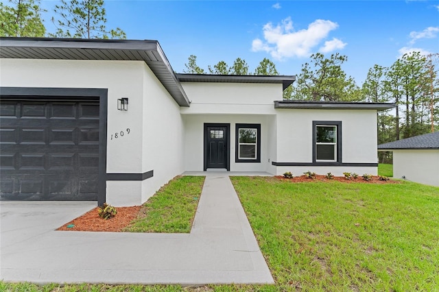 1809 W Linden Dr, Citrus Springs, FL 34434 - view of front facade with stucco siding, a garage, a front lawn, and concrete driveway