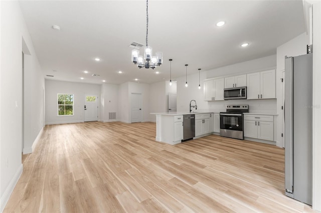 1809 W Linden Dr, Citrus Springs, FL 34434 - kitchen with stainless steel appliances, open floor plan, a peninsula, a chandelier, and recessed lighting