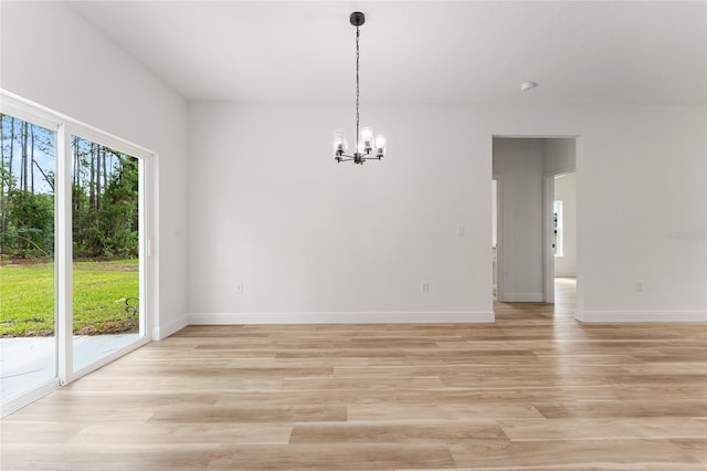 1809 W Linden Dr, Citrus Springs, FL 34434 - unfurnished dining area with a chandelier and light wood-style floors