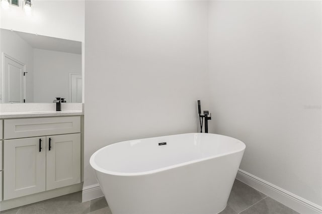 1809 W Linden Dr, Citrus Springs, FL 34434 - full bath with a freestanding tub, vanity, and tile patterned flooring