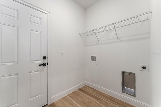 1809 W Linden Dr, Citrus Springs, FL 34434 - washroom with hookup for a washing machine, electric dryer hookup, and light wood finished floors