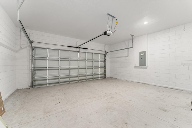 1809 W Linden Dr, Citrus Springs, FL 34434 - garage featuring electric panel, a garage door opener, and concrete block wall