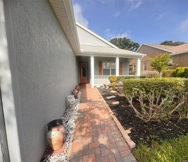 1180 Mesa Verde Ct, Clermont, FL 34711 - property entrance with a porch and stucco siding