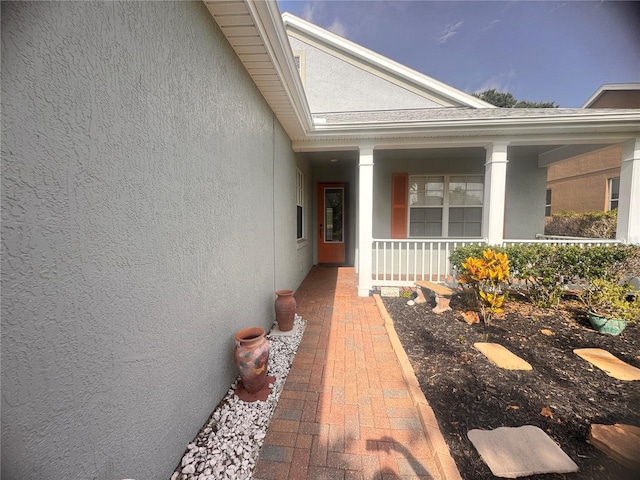 1180 Mesa Verde Ct, Clermont, FL 34711 - view of exterior entry featuring stucco siding and covered porch