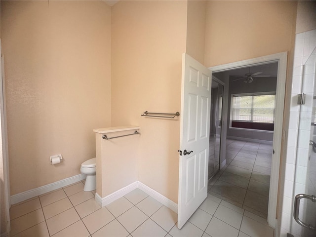 1180 Mesa Verde Ct, Clermont, FL 34711 - full bathroom featuring toilet, tile patterned flooring, baseboards, and a ceiling fan