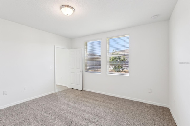 4973 Kaia Ave, Winter Haven, FL 33884 - unfurnished room featuring carpet floors and baseboards