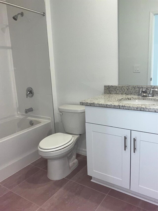 4957 Kaia Ave, Winter Haven, FL 33884 - bathroom with toilet, vanity, shower / bathtub combination, and tile patterned floors