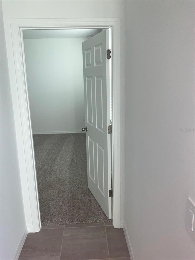 4957 Kaia Ave, Winter Haven, FL 33884 - hallway featuring baseboards and carpet flooring