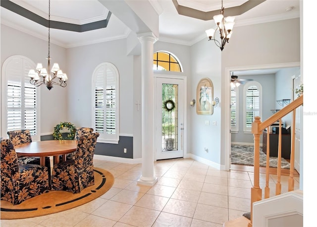 9335 San Jose Blvd, Howey In The Hills, FL 34737 - foyer entrance featuring a chandelier, a raised ceiling, light tile patterned floors, and crown molding