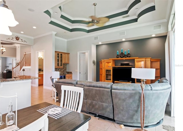 9335 San Jose Blvd, Howey In The Hills, FL 34737 - living area with ornamental molding, light tile patterned floors, a ceiling fan, a chandelier, and recessed lighting