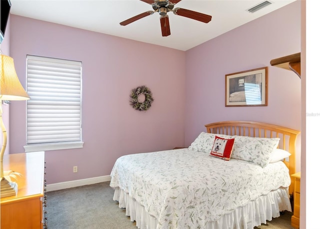 9335 San Jose Blvd, Howey In The Hills, FL 34737 - carpeted bedroom with baseboards and ceiling fan