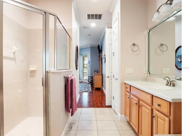 9335 San Jose Blvd, Howey In The Hills, FL 34737 - full bathroom featuring crown molding, a shower stall, vanity, and tile patterned floors