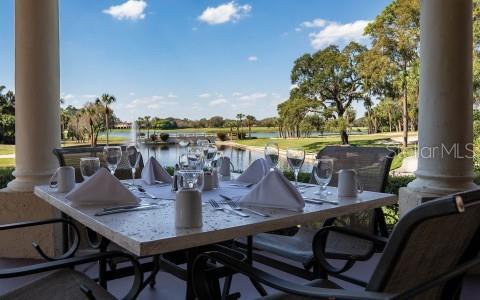 9335 San Jose Blvd, Howey In The Hills, FL 34737 - view of patio featuring a water view