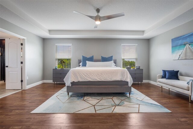 637 Neptune Dr, Groveland, FL 34736 - bedroom with multiple windows, wood finished floors, and baseboards