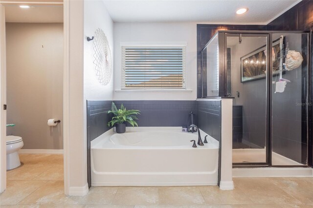 637 Neptune Dr, Groveland, FL 34736 - bathroom featuring a bath, toilet, a stall shower, tile patterned floors, and recessed lighting