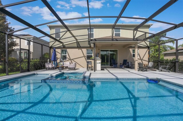 637 Neptune Dr, Groveland, FL 34736 - view of pool featuring a patio, a pool with connected hot tub, a ceiling fan, and glass enclosure